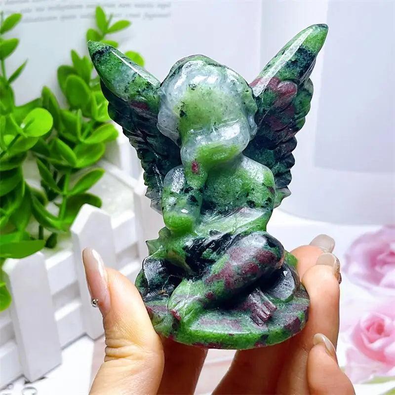 Hand-carved Ruby in Zoisite angel figurine featuring striking forest green and vivid red-pink patterns for heart healing.