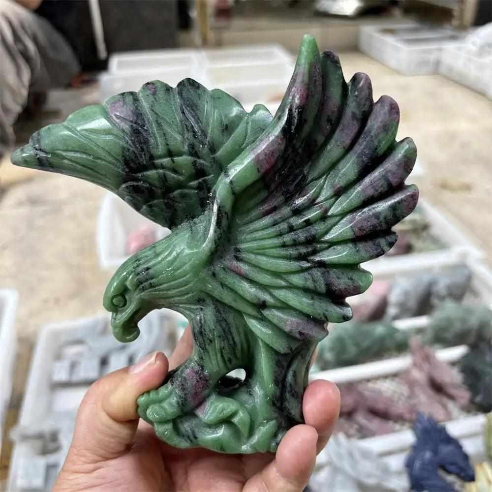 Hand-carved Ruby in Zoisite eagle sculpture featuring deep green, ruby red, and black hornblende for heart-centered energy.