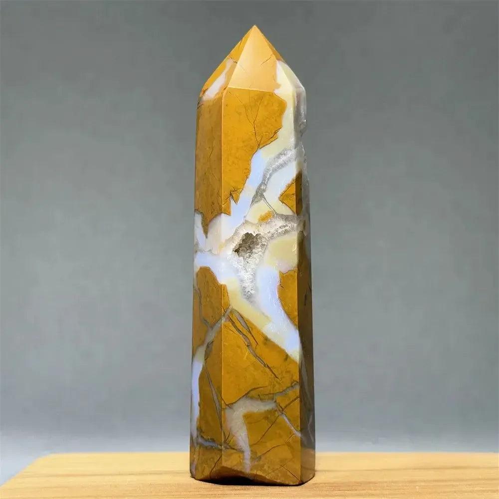 Polished natural Yellow Agate crystal tower with warm golden tones, white banding, and a geode cavity.
