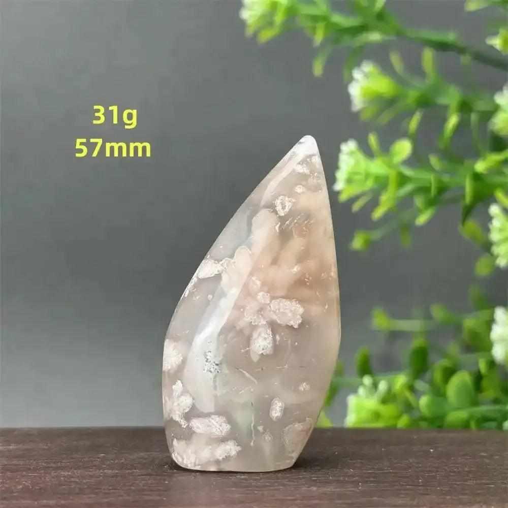 Polished Sakura Agate torch freeform with pink cherry blossom patterns, 57mm tall, perfect for Heart Chakra healing.