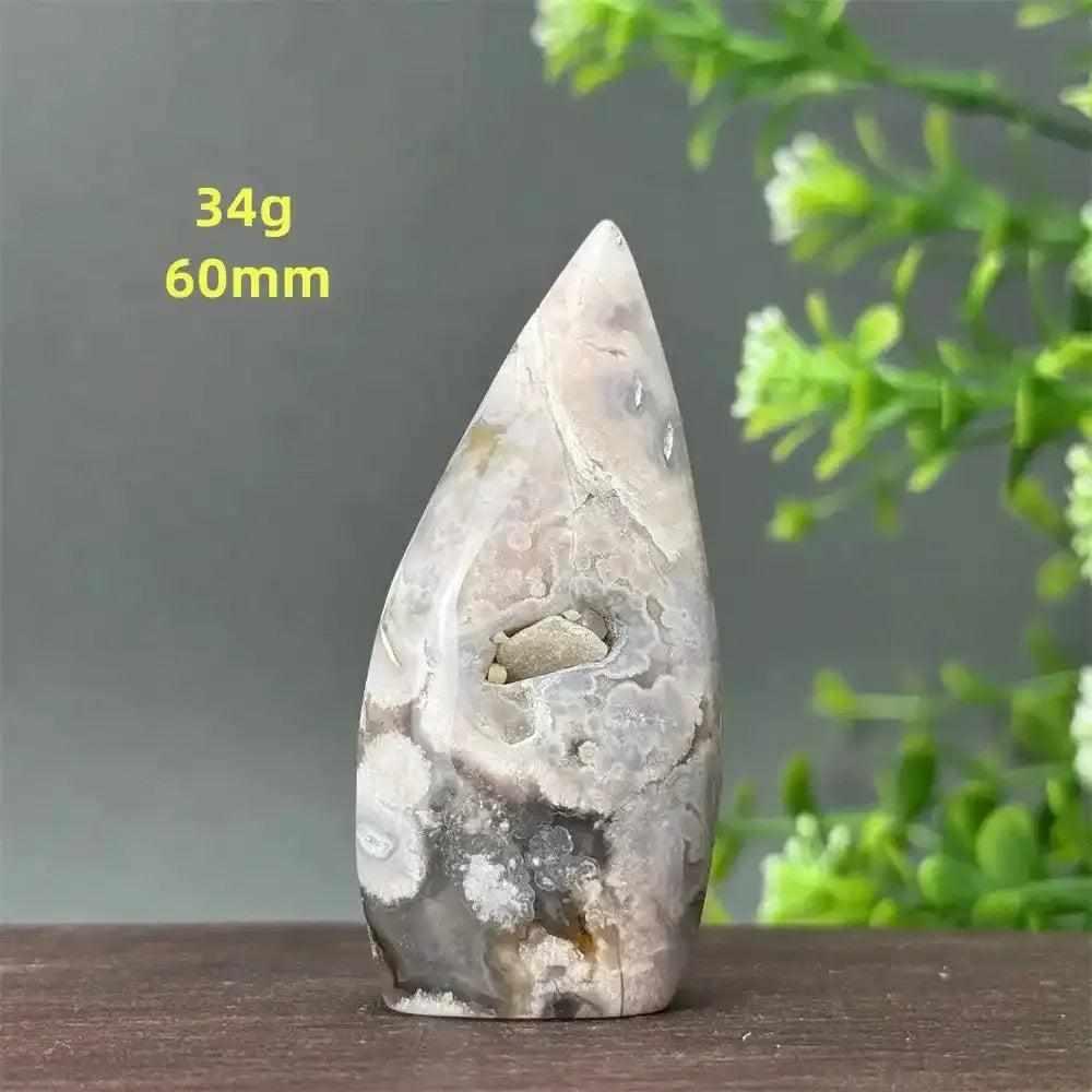 Polished Sakura Agate torch freeform with pink and white cherry blossom patterns, perfect for Heart Chakra healing.