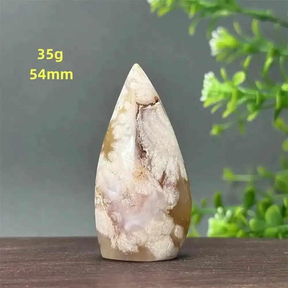 Polished sakura agate torch freeform with pink and white cherry blossom patterns, perfect for Heart Chakra healing.