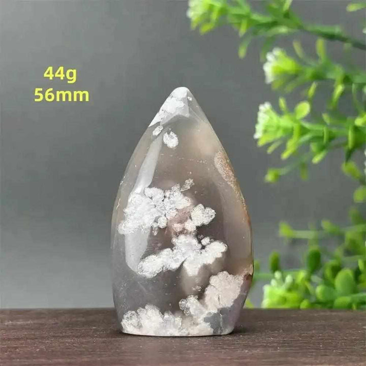 Polished Sakura Agate torch freeform with soft pink and white floral patterns, perfect for Heart Chakra healing.