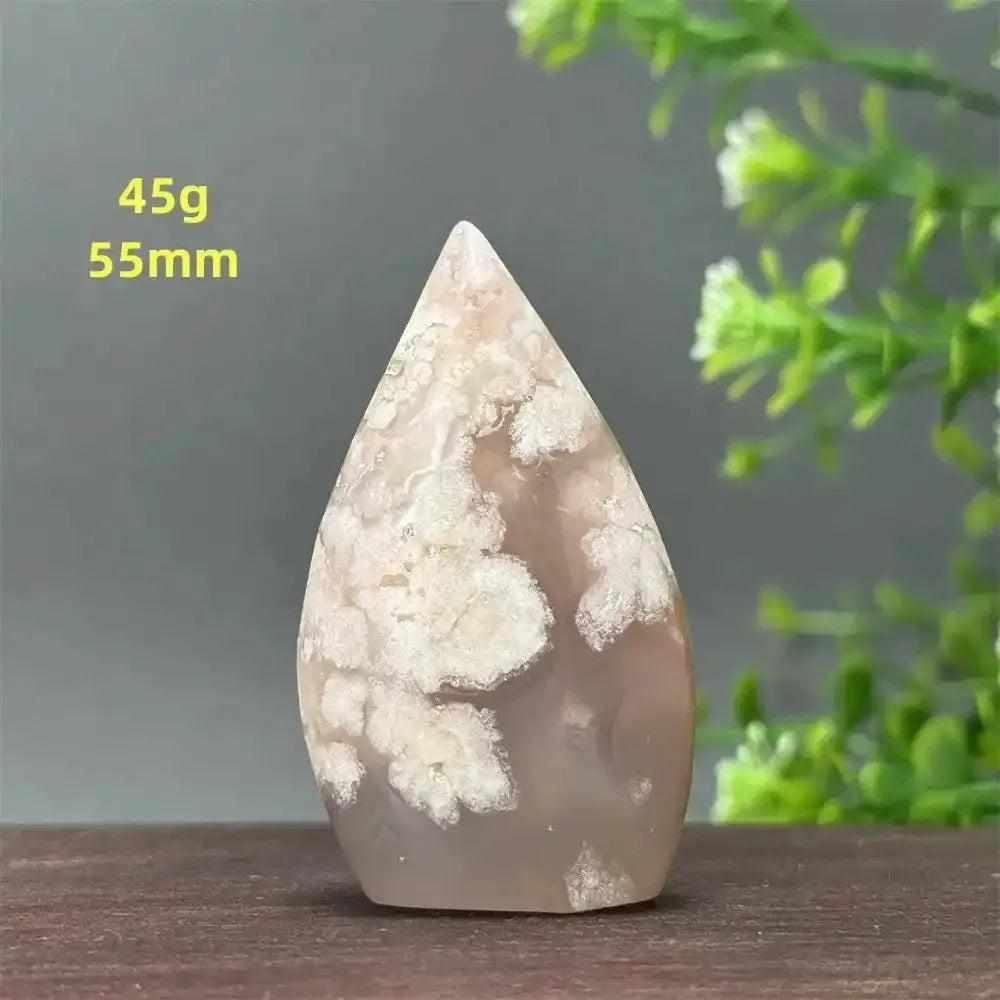 Polished Sakura Agate torch freeform with soft pink and white floral patterns, perfect for Heart Chakra healing and decor.