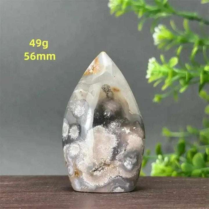 Polished Sakura Agate torch freeform with pink and white cherry blossom patterns, perfect for Heart Chakra healing.