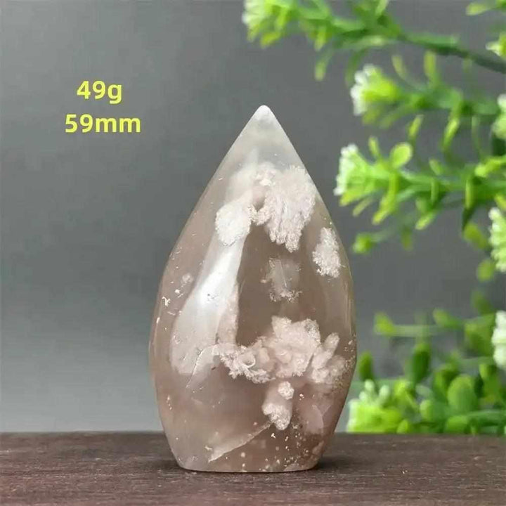 Polished Sakura Agate torch freeform with soft pink cherry blossom patterns, perfect for Heart Chakra healing and decor.