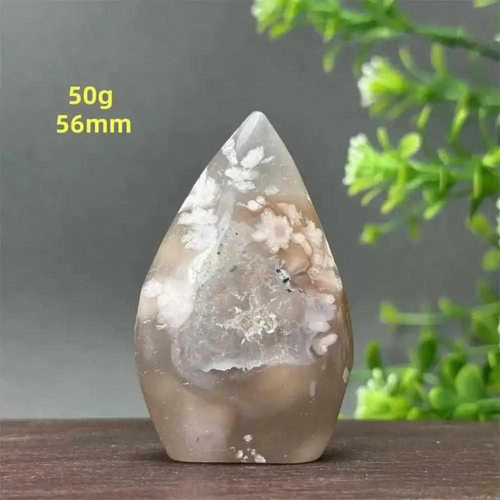Polished Sakura Agate torch freeform with soft pink and white floral patterns for Heart Chakra healing and self-love.