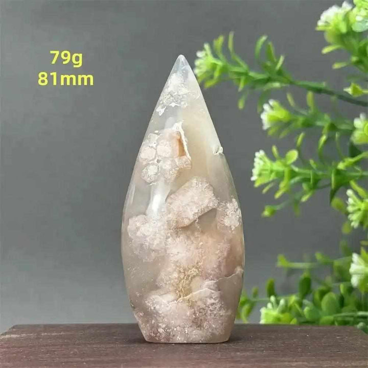 Polished Sakura Agate torch freeform with soft pink cherry blossom patterns, perfect for Heart Chakra healing and decor.