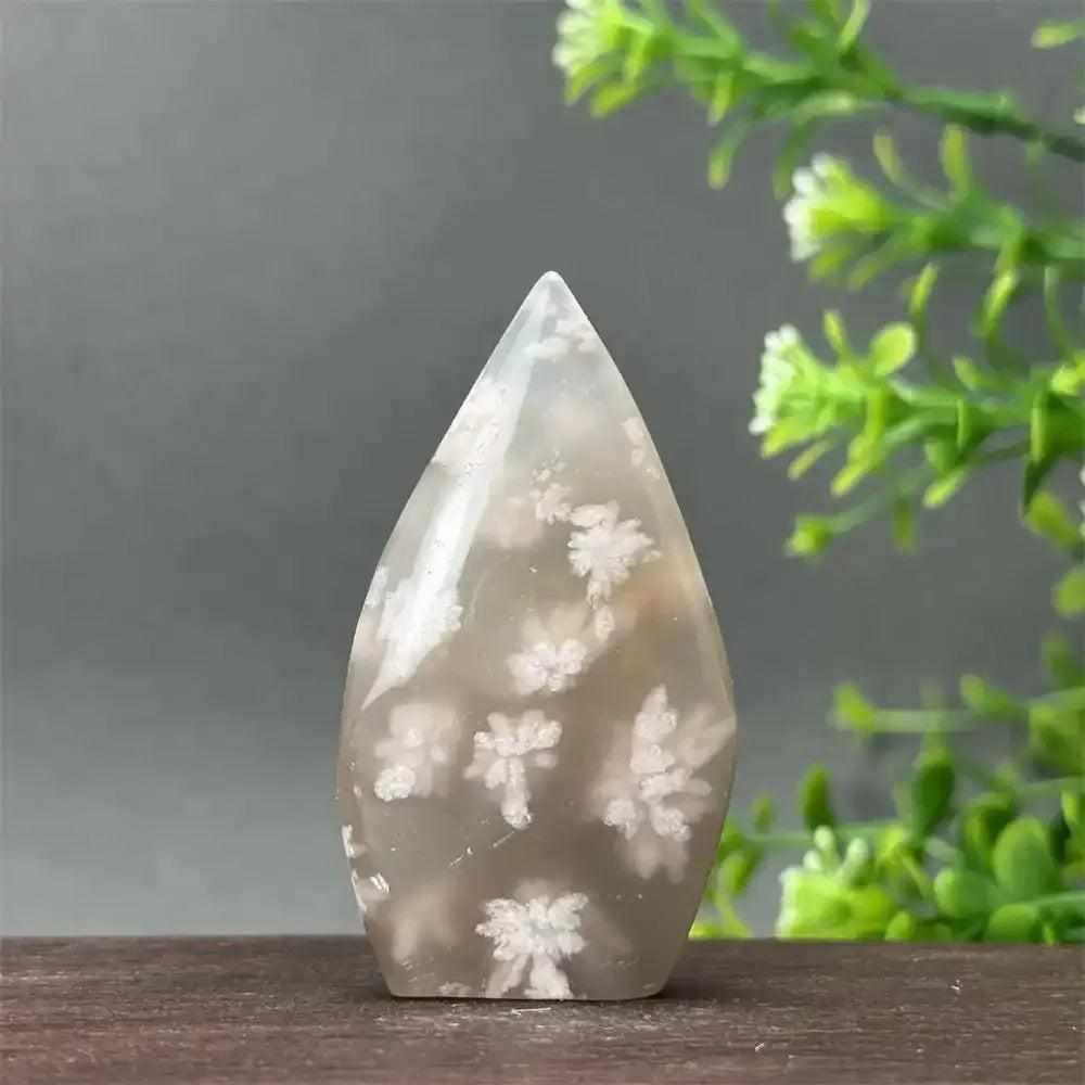 Polished Sakura Agate torch freeform with soft pink and white floral patterns for Heart Chakra healing and home decor.