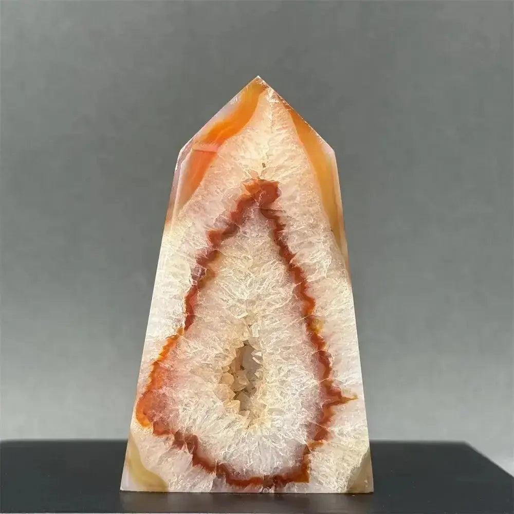 Polished Sardonyx Agate Tower from Crystal Destiny, featuring striking red, orange, and white bands with a sparkling geode center.