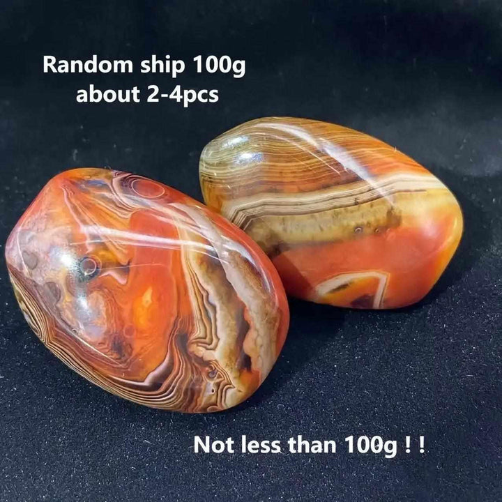 Polished Sardonyx palm stones featuring natural reddish-brown, honey, and white bands for grounding and strength.