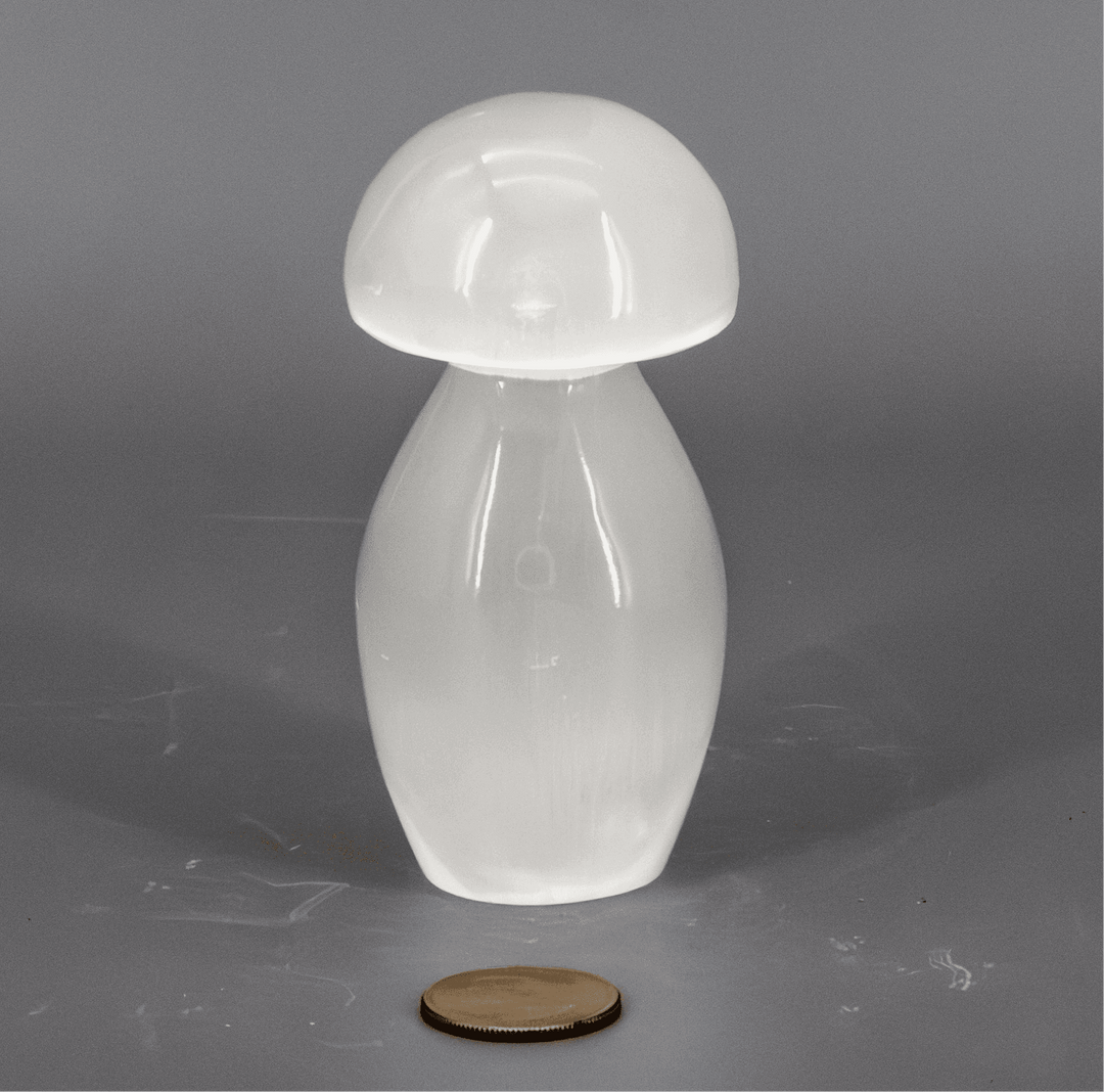 Translucent white Selenite Carved Mushroom, a self-cleansing energy tool with a pearlescent, moonlike luster.