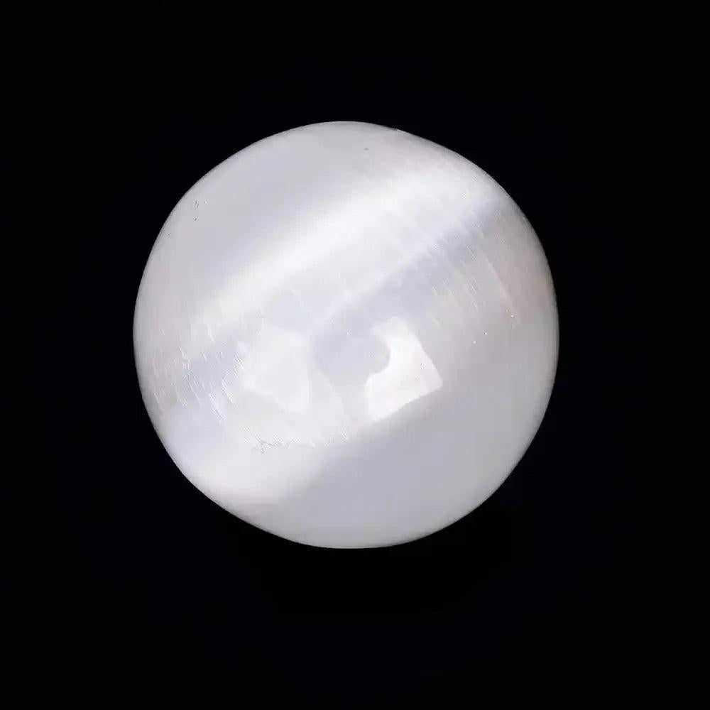 Polished white Selenite crystal sphere with a silky, glowing sheen for peaceful energy and Crown Chakra cleansing.