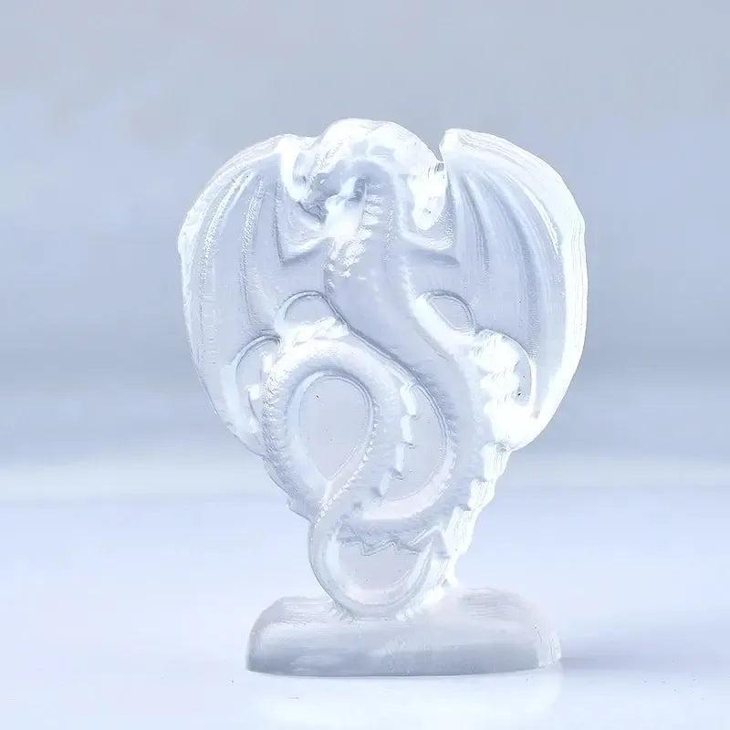 Luminous white selenite fire dragon carving from Crystal Destiny, showcasing pearly translucence and detailed mythical form.