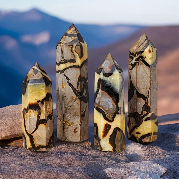 Four Septarian Stone Crystal Towers with warm ochre, deep chocolate, and grey calcite patterns, offering grounding energy.