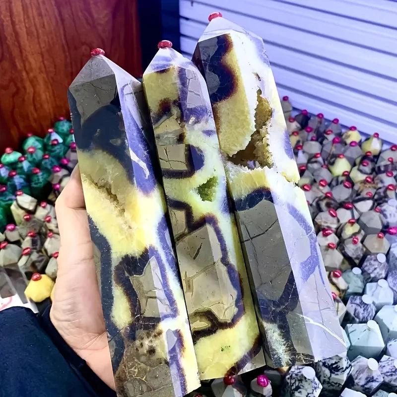 Septarian Stone Crystal Tower: Hand-polished hexagonal obelisks with warm ochre, deep chocolate, and grey calcite patterns. Grounding and stable.