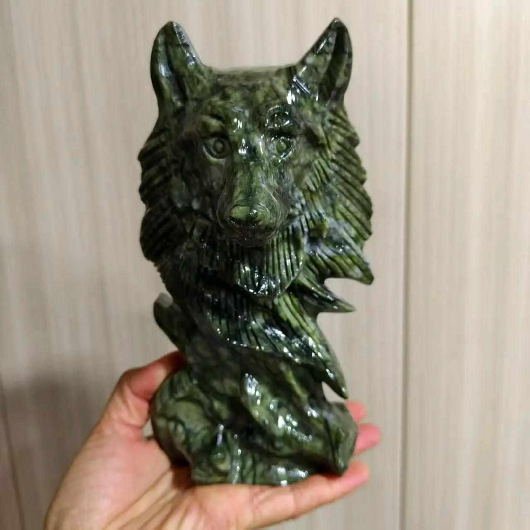 Large Serpentine crystal wolf head carving, a grounding green statement piece with detailed, expressive craftsmanship.
