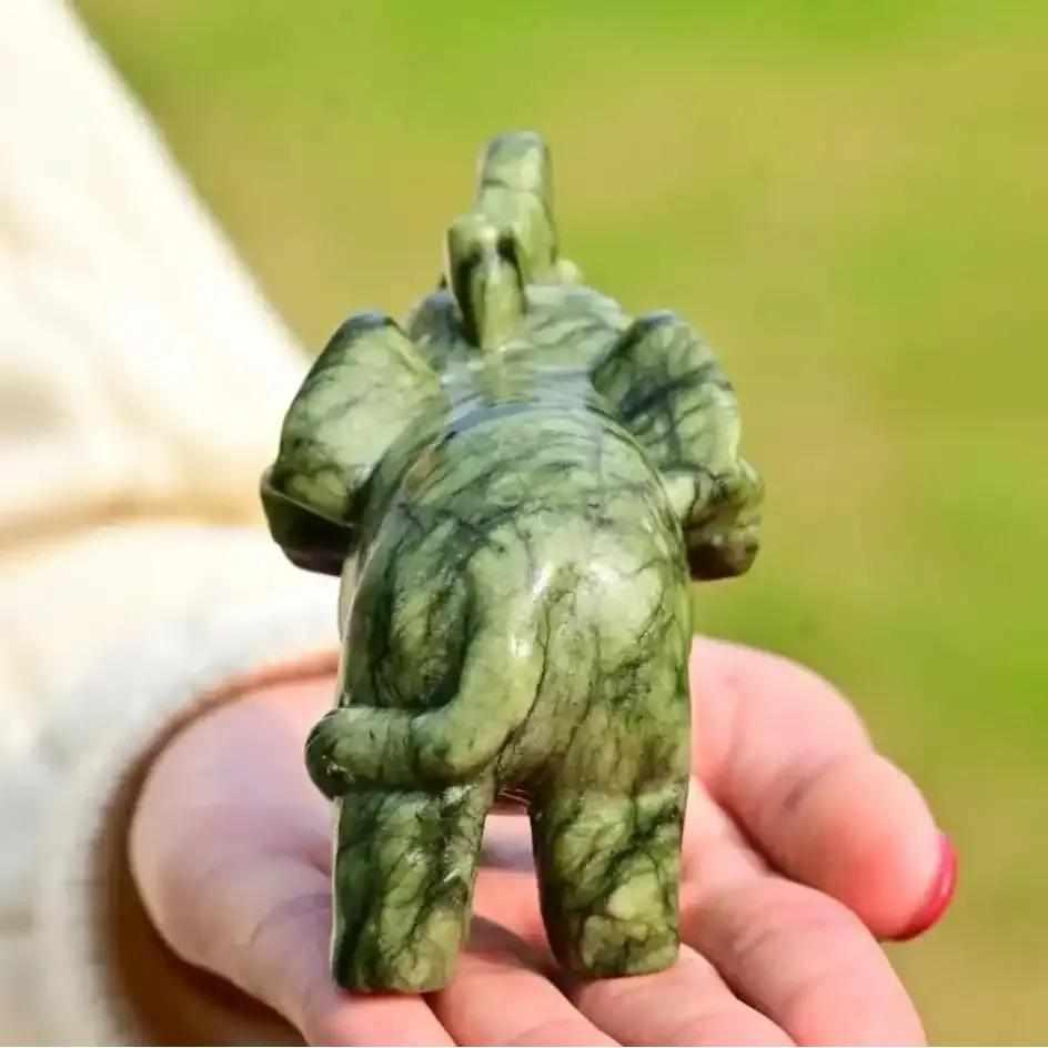 Polished 50mm Serpentine Elephant carving in soft green stone, a symbol of wisdom and Heart Chakra growth.