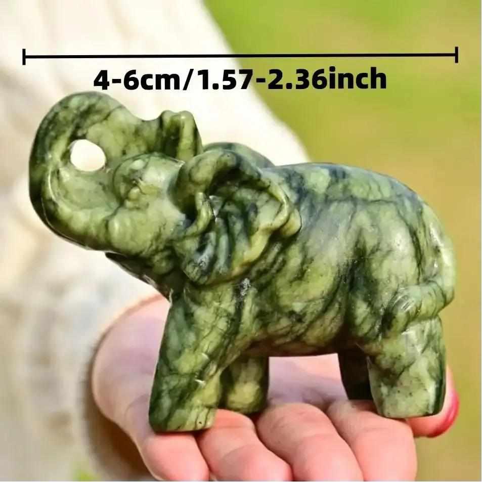 Polished 50mm Serpentine Elephant carving in soft green stone, a symbol of wisdom and heart chakra growth.