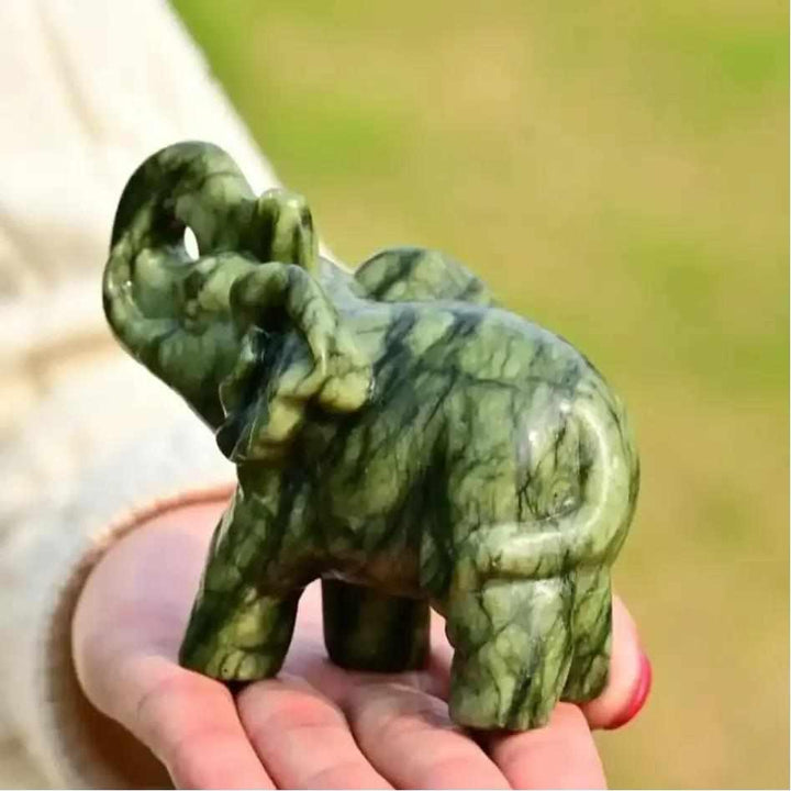 50mm Serpentine Elephant carving in polished soft green stone, a symbol of wisdom and heart chakra growth.