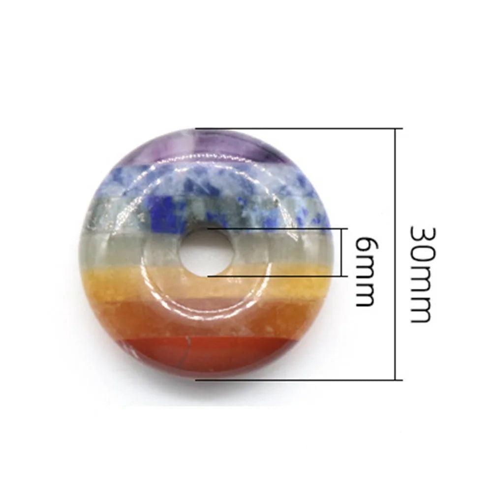 Polished Seven Chakra Crystal Fused donut, 30mm diameter, 6mm thick, showcasing vibrant layered natural stones.