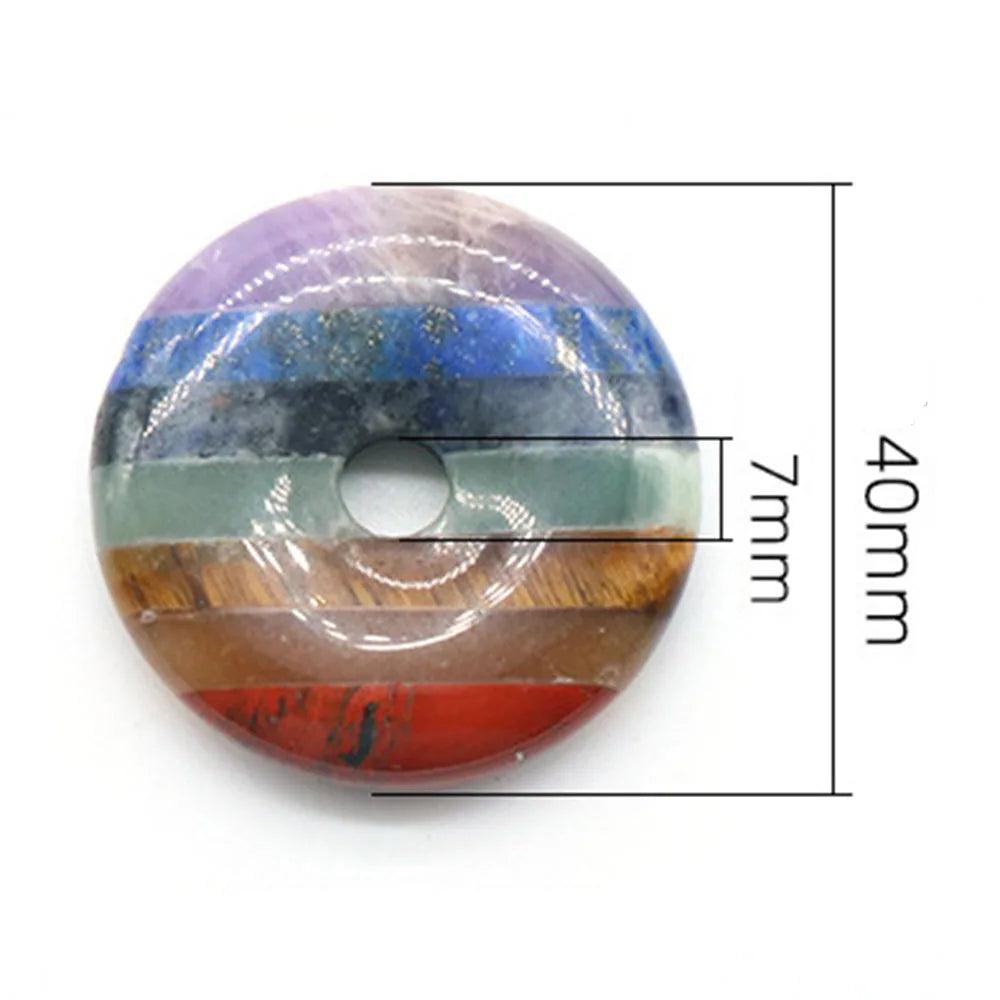 Polished Seven Chakra Crystal Fused donut, 40mm wide with 7mm hole, showcasing vibrant layers of natural healing stones.