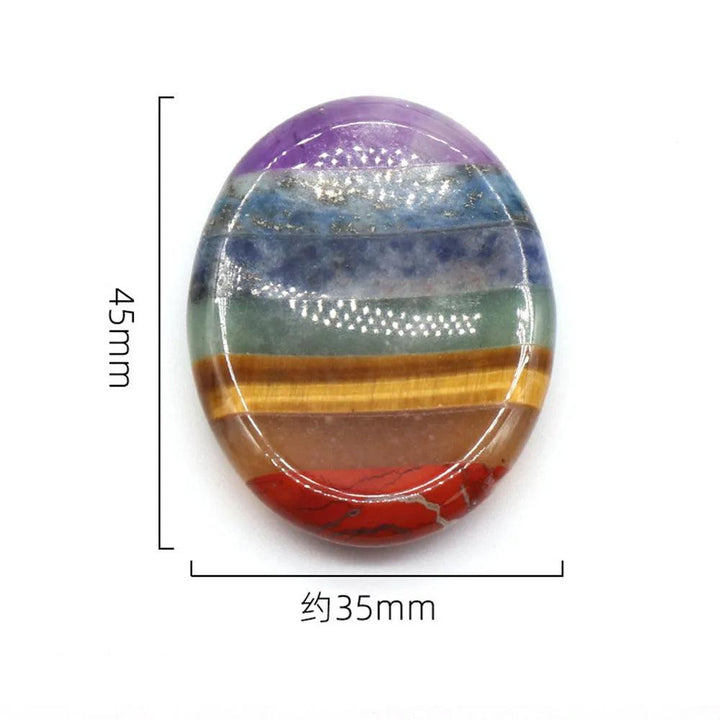 Polished 45mm x 35mm Seven Chakra Crystal Fused Polished Stone Collection palm stone, showcasing vibrant layers of natural healing crystals.