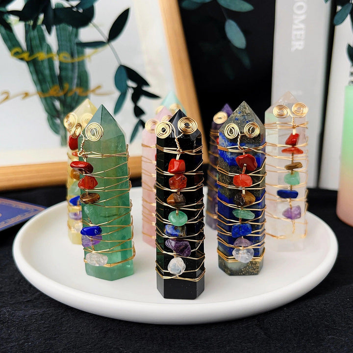 Natural stone chakra crystal towers with copper wire winding and colorful gemstone chips.