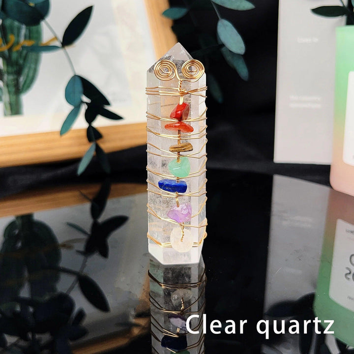 Clear quartz tower with gold wire wrapping and seven chakra crystal chips.
