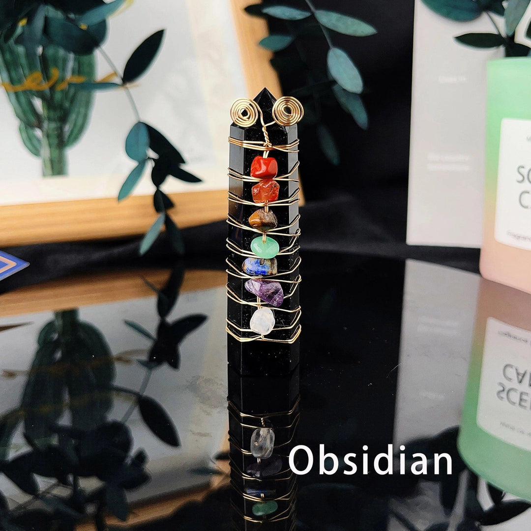 Black obsidian tower with copper wire and seven chakra crystal chips for energy healing.