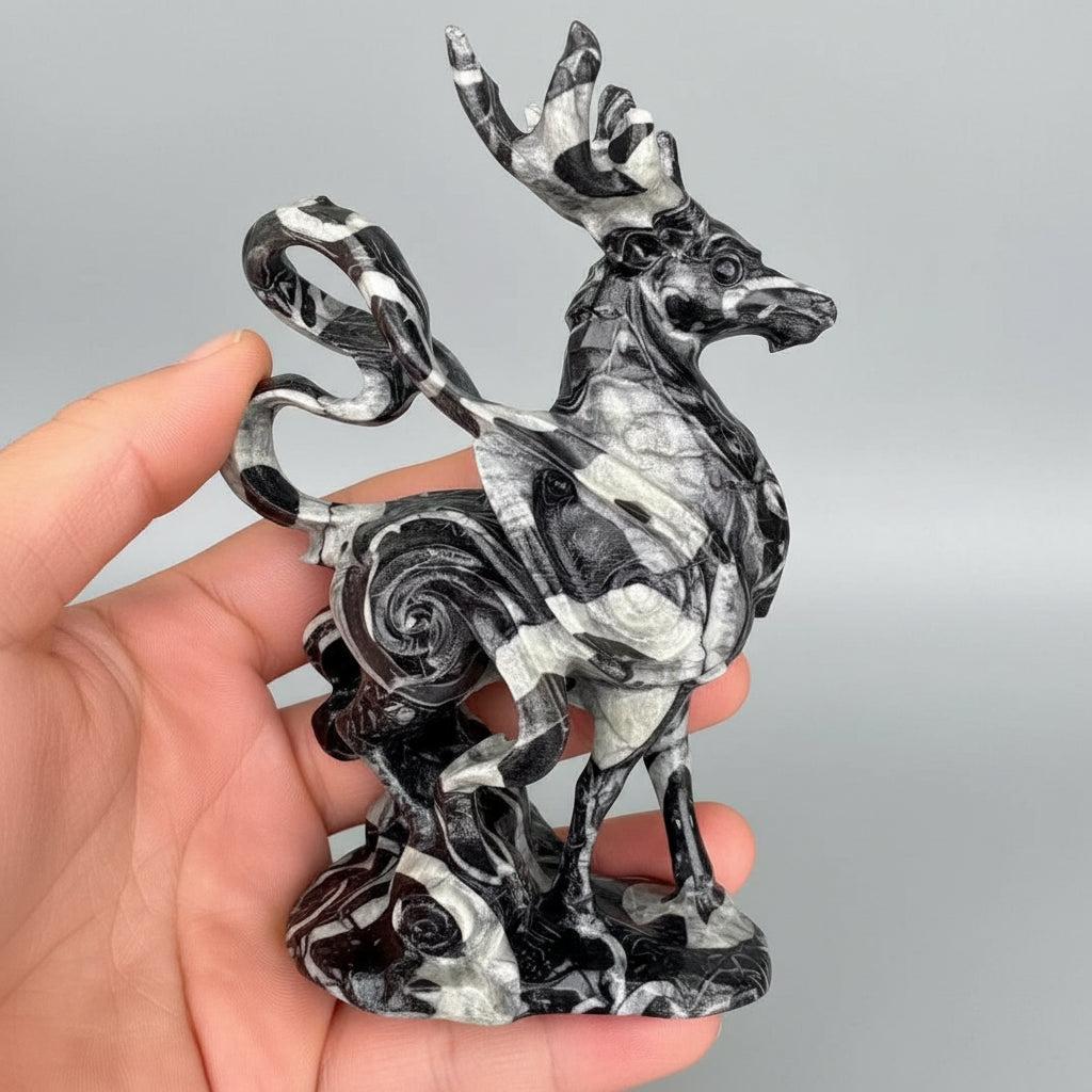 Polished 120mm shell stone deer figurine with striking black and white organic patterns for healing and tranquility.
