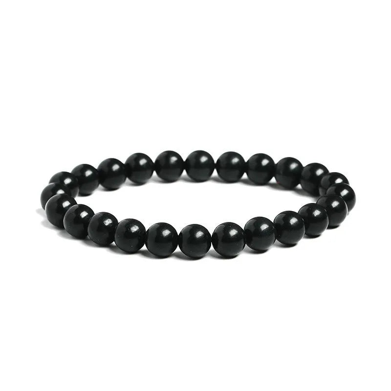 Shungite Bead Bracelet: side view of the black stretch bracelet on white