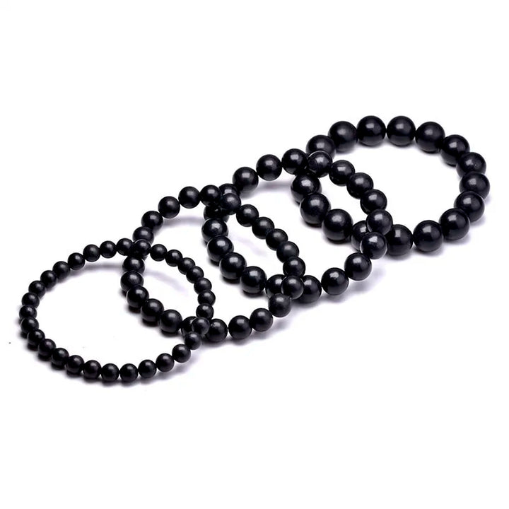 Shungite Bead Bracelet: five black bracelets lined up from small to large beads