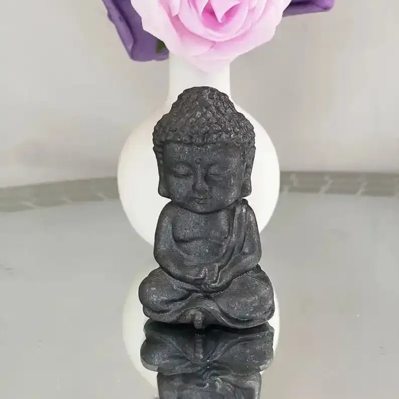 80mm black shungite Buddha carving for Root Chakra grounding, featuring detailed robes and a serene seated design.