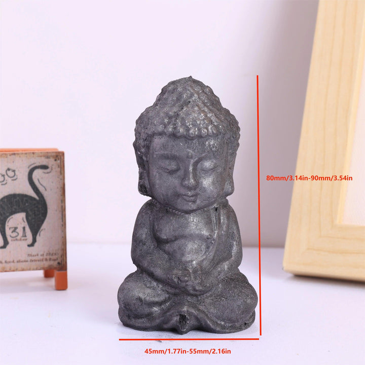 Matte black Shungite Crystal Carved Buddha Statue for grounding and protective energy.