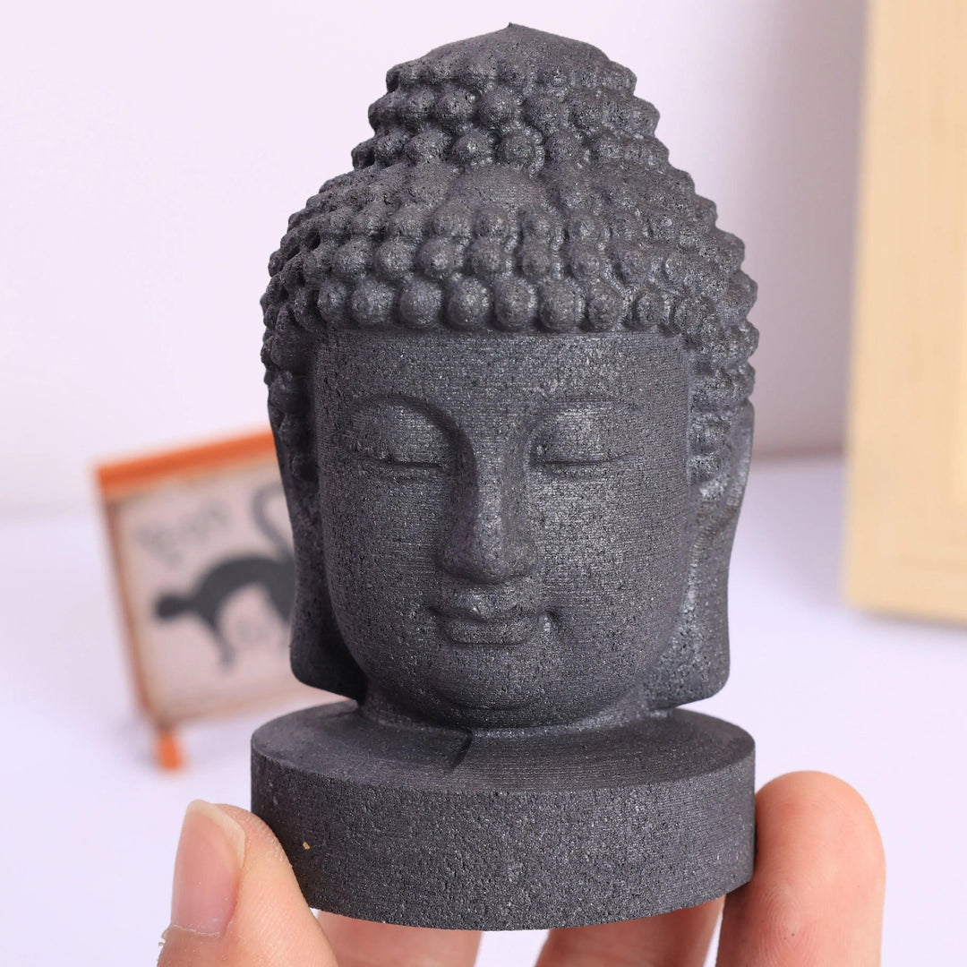 Matte black Shungite Crystal Carved Buddha Statue head for grounding and protection.
