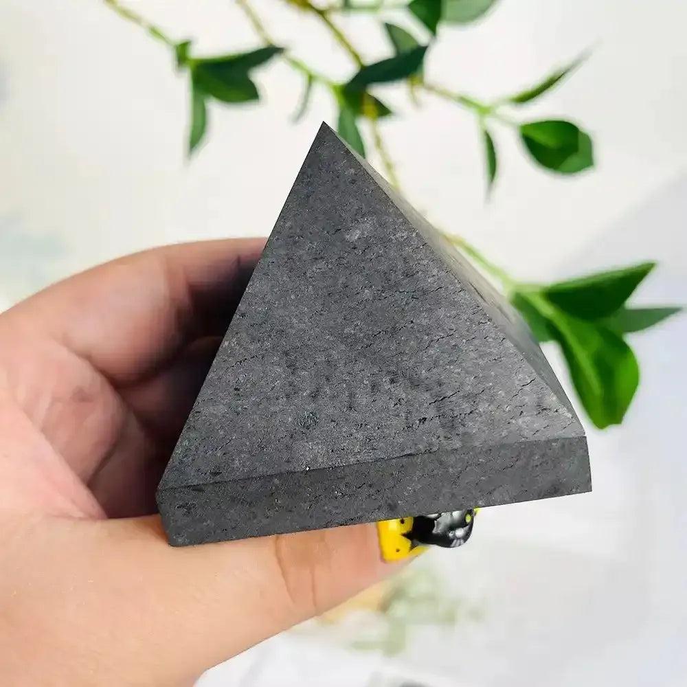 Hand-polished satin black Shungite crystal pyramid for Root chakra grounding, protection, and sacred energy work.
