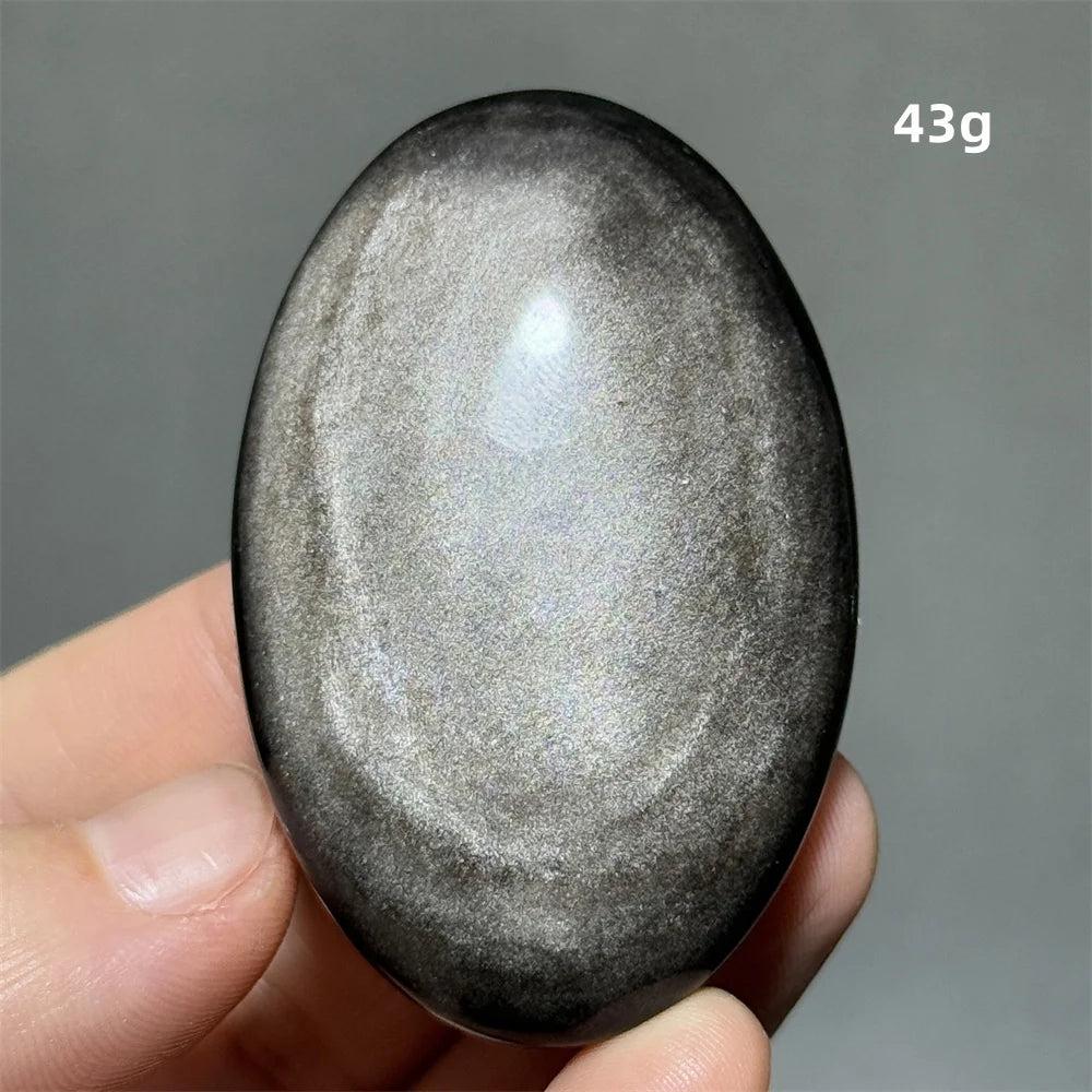 Polished 43g Silver Sheen Obsidian palm stone with a glossy black surface and reflective metallic shimmer for grounding.