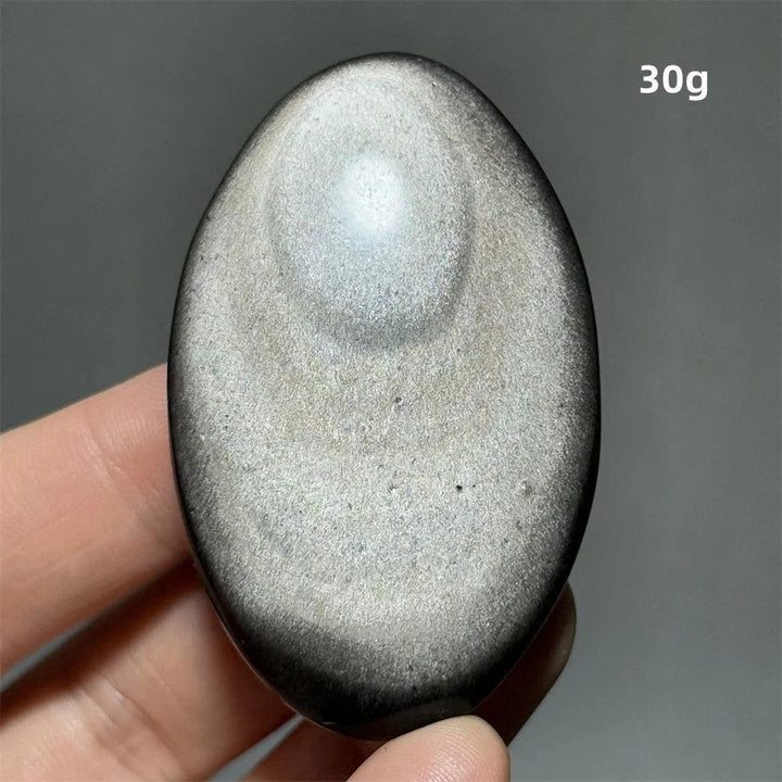 Polished 30g Silver Sheen Obsidian palm stone with a glossy black surface and reflective silvery shimmer for grounding.