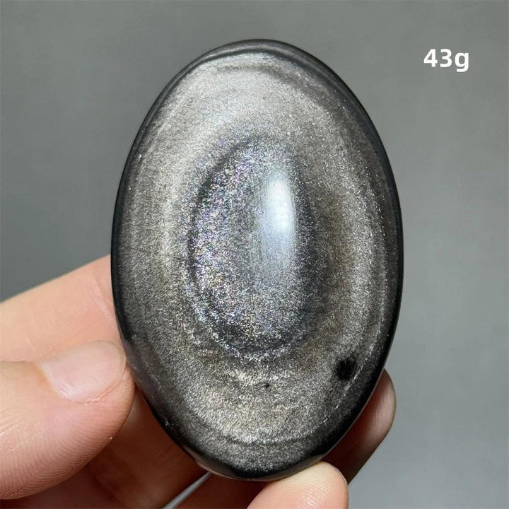 Polished 43g Silver Sheen Obsidian palm stone with a glossy black surface and shimmering silver light for grounding.