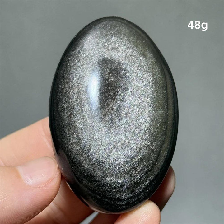 Polished 48g Silver Sheen Obsidian palm stone with a glossy black surface and shimmering silver reflection for grounding.