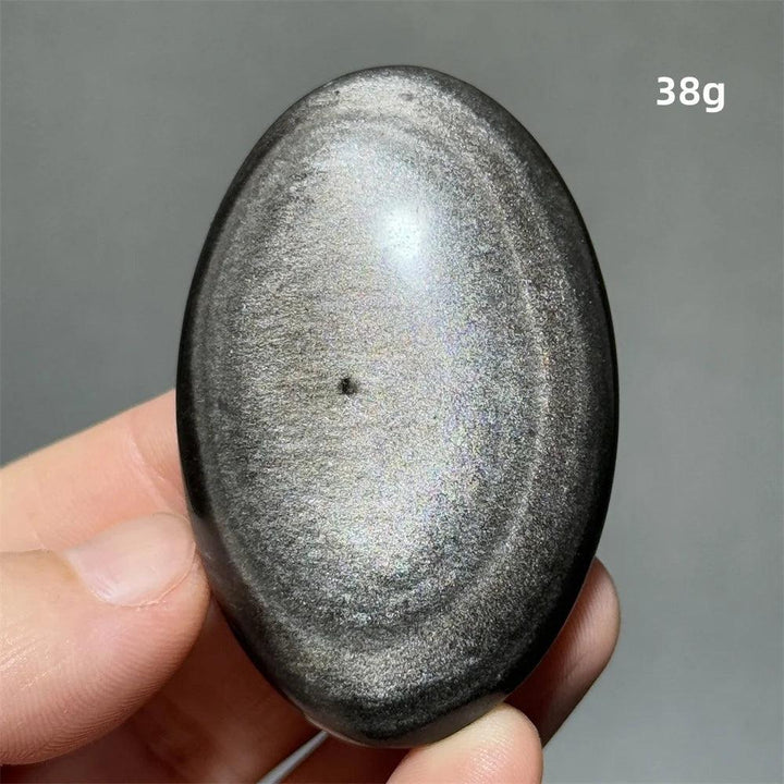 Polished 38g Silver Sheen Obsidian palm stone with a glossy black surface and shimmering silver reflection for grounding.