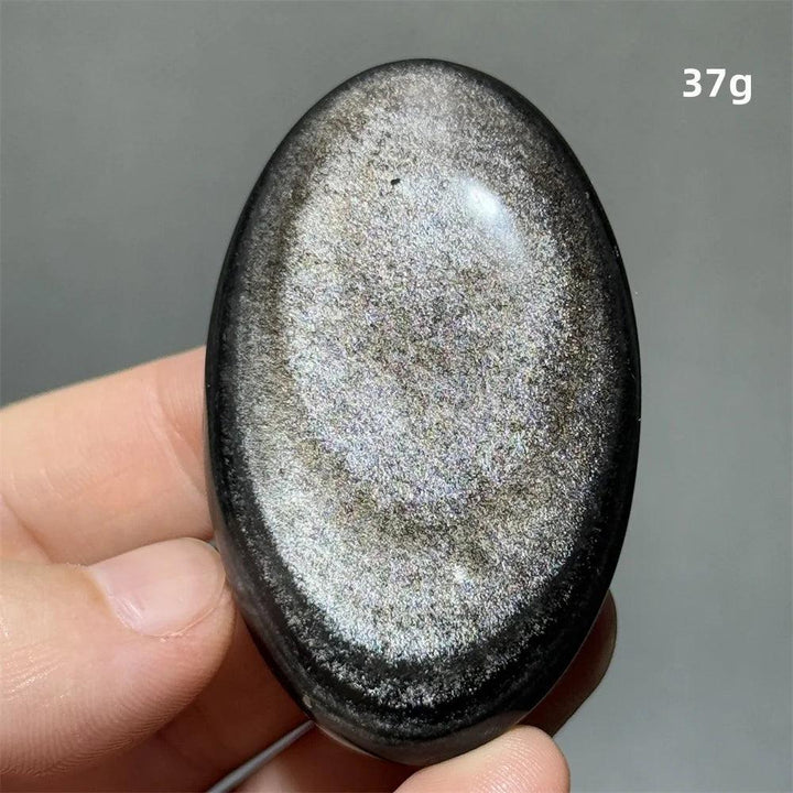 Polished 37g Silver Sheen Obsidian palm stone with a glossy black surface and radiant silvery shimmer for grounding.