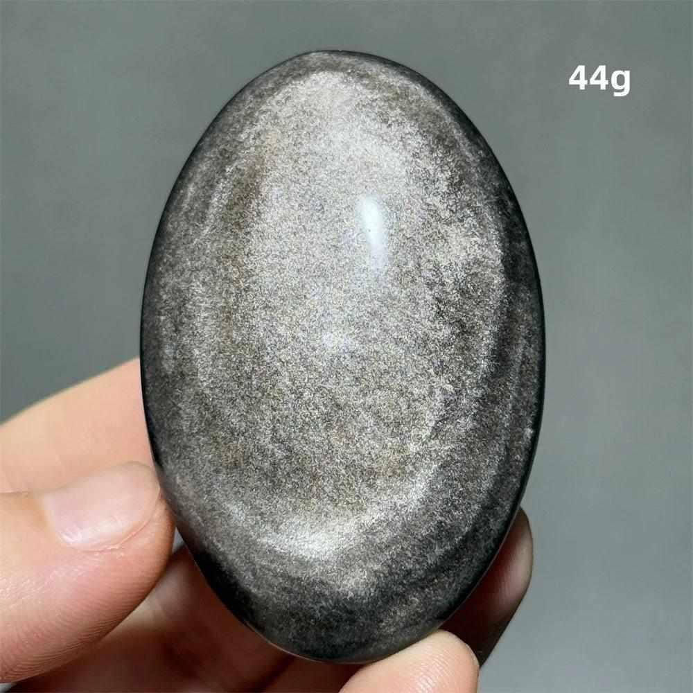 Polished 44g Silver Sheen Obsidian palm stone with a glossy black surface and shimmering silver reflection for grounding.