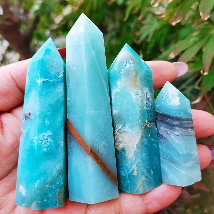 Polished sky blue quartz columns with natural mineral inclusions, perfect for healing home decor.