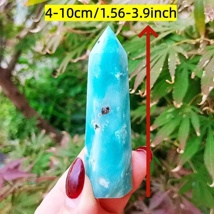 Vibrant sky blue quartz crystal column for healing energy and home decor.