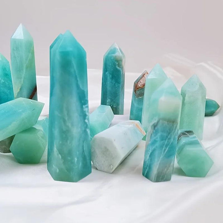 Polished sky blue quartz crystal columns with soothing healing energy for home decor.
