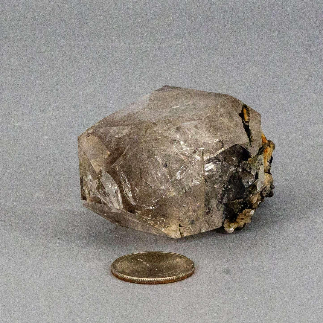 Rare Smoky Herkimer Quartz Point: a naturally double-terminated crystal with grounding smoky hue and inclusions.