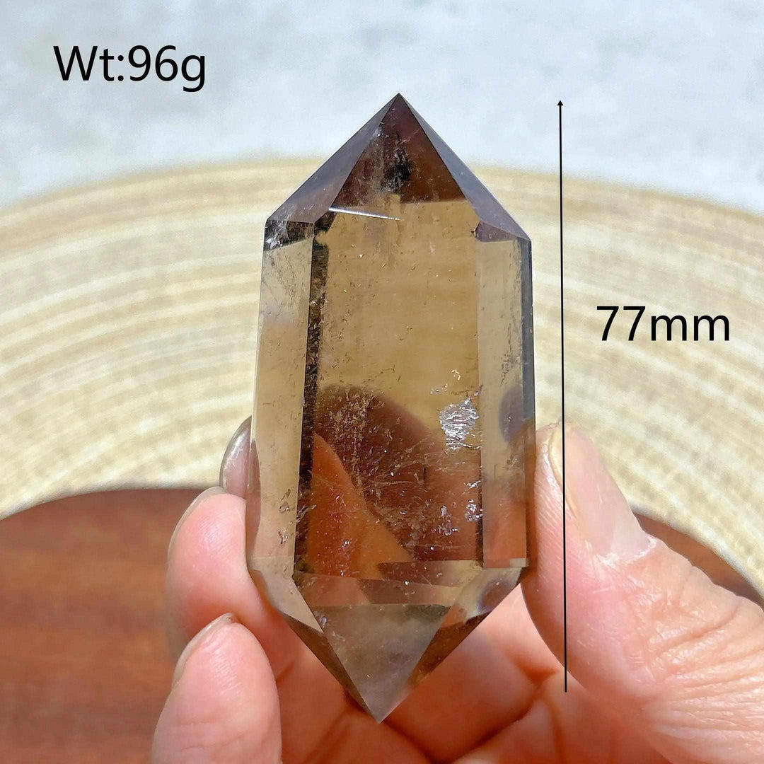 77mm smoky quartz double point crystal tower with natural rainbow inclusions, perfect for meditation and energy work.