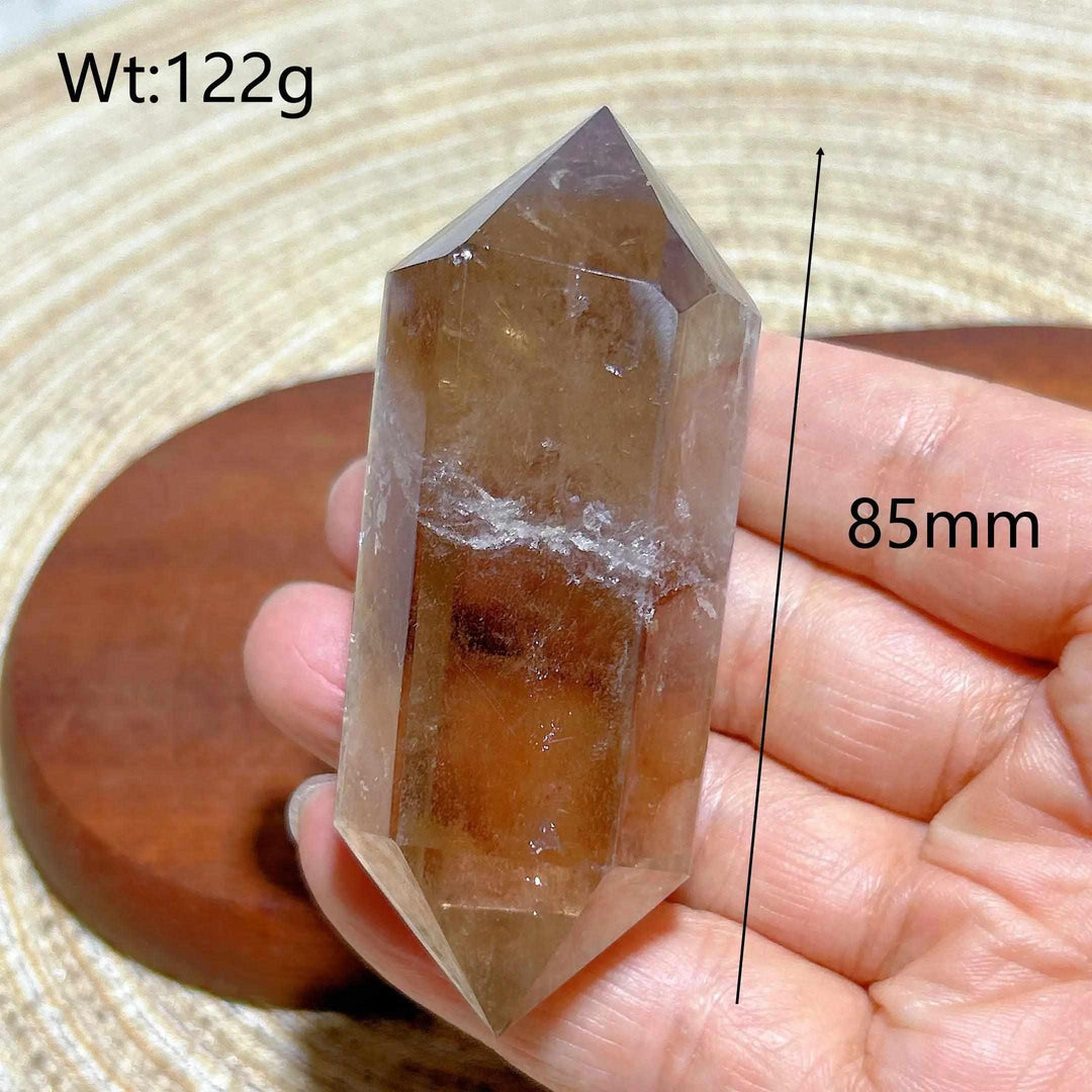 85mm smoky quartz double point crystal with natural rainbow inclusions, perfect for meditation and energy work.